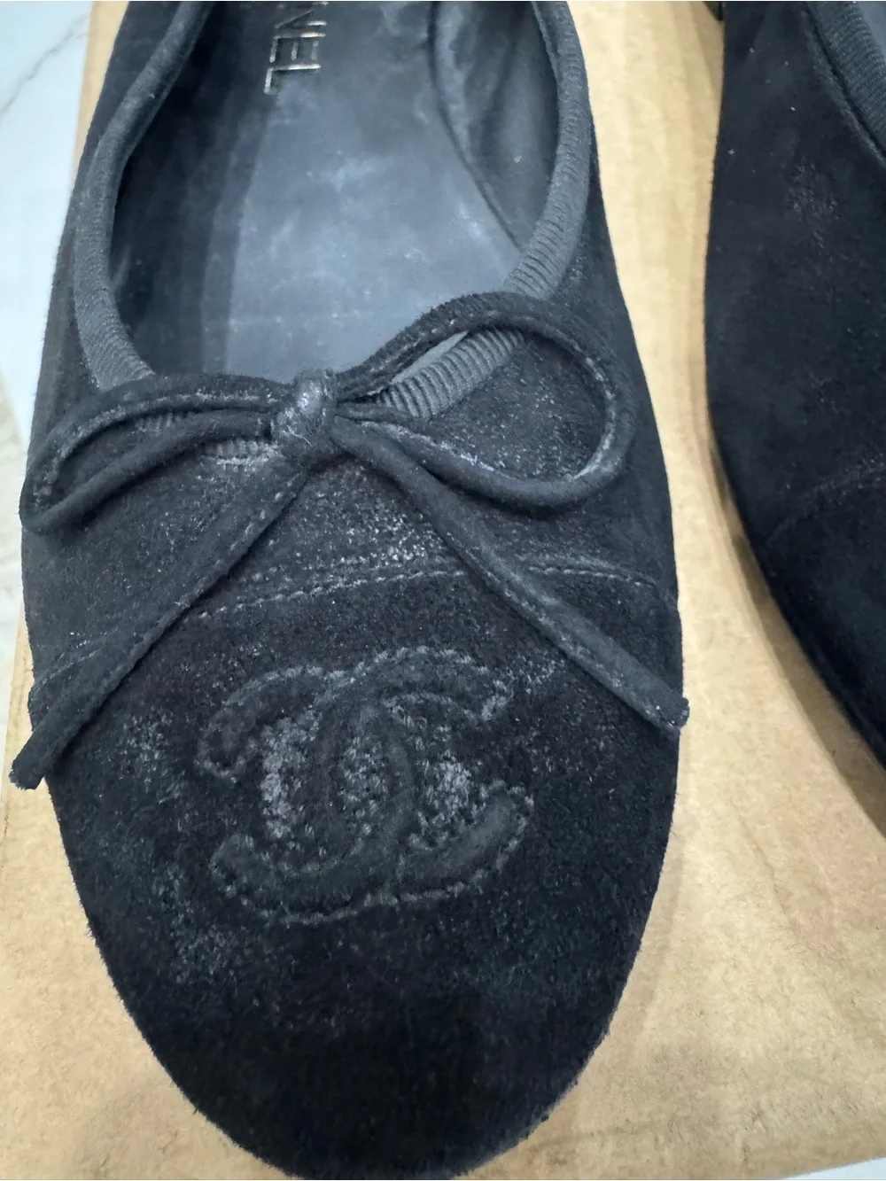 CHANEL Black Suede Ballet Flats with Embroidered CC and Bow Accent